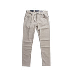 A pair of light beige slim-fit jeans shown flat against a solid white background. 7 For All Mankind Chinos available at Sakks Menswear in Southampton.