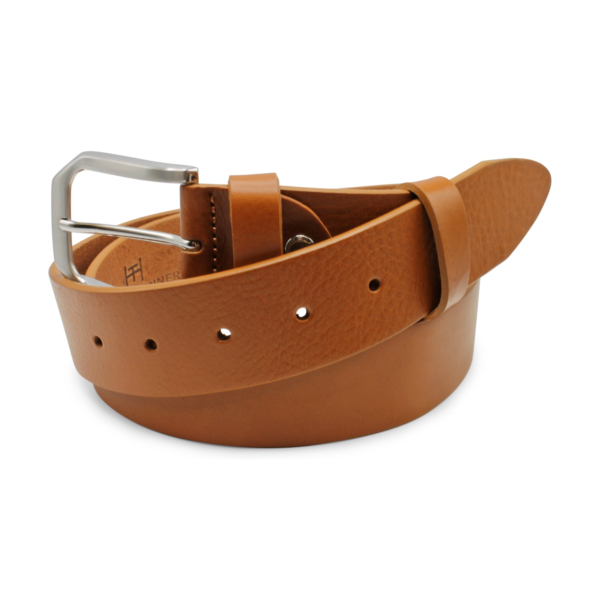 A tan leather belt with a silver-tone metal buckle, coiled on a white background. Huxley Tanner Belt available at Sakks Menswear in Southampton.