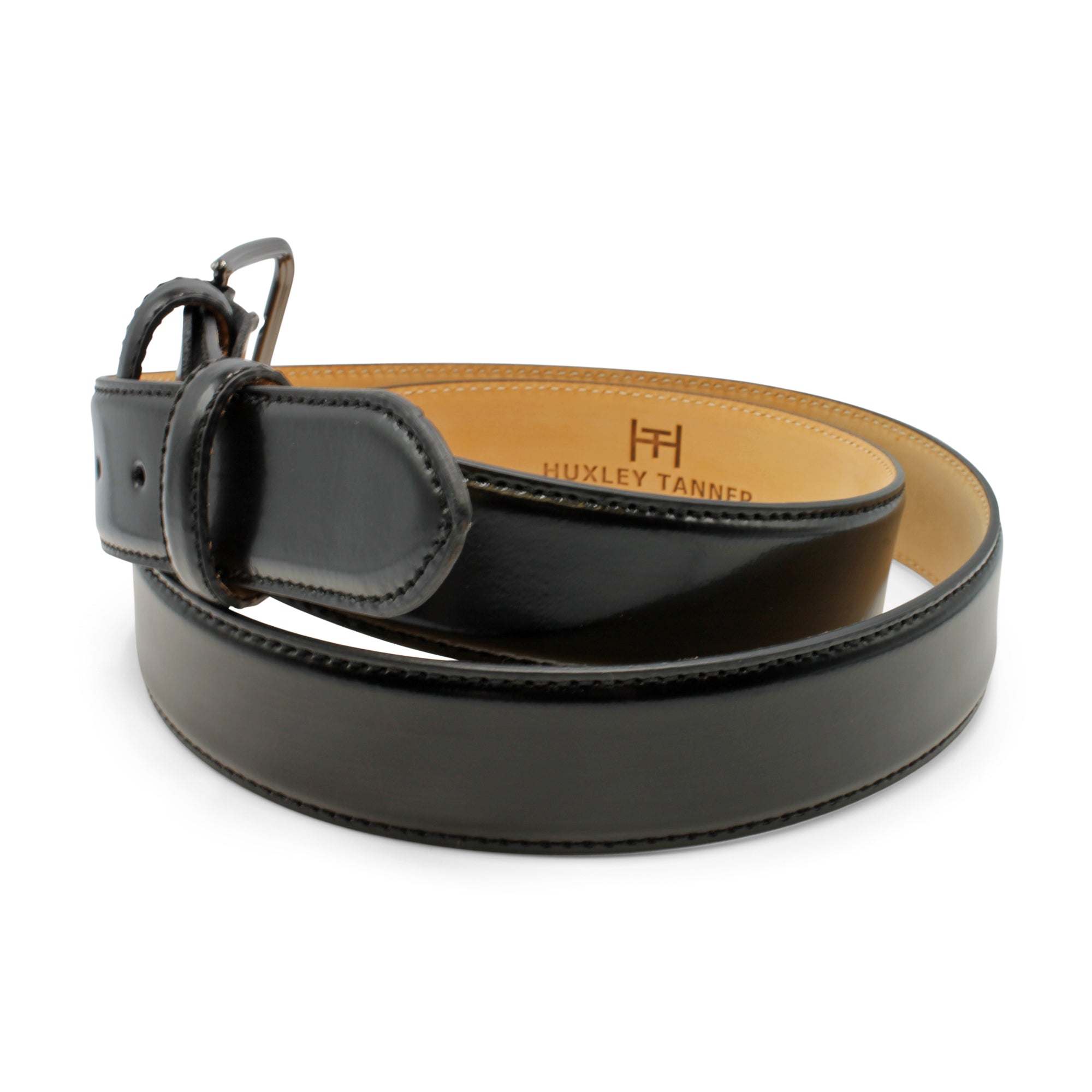 Black leather belt with a visible brand logo on a white background. Huxley Tanner Belt Available at Sakks Menswear in Southampton.