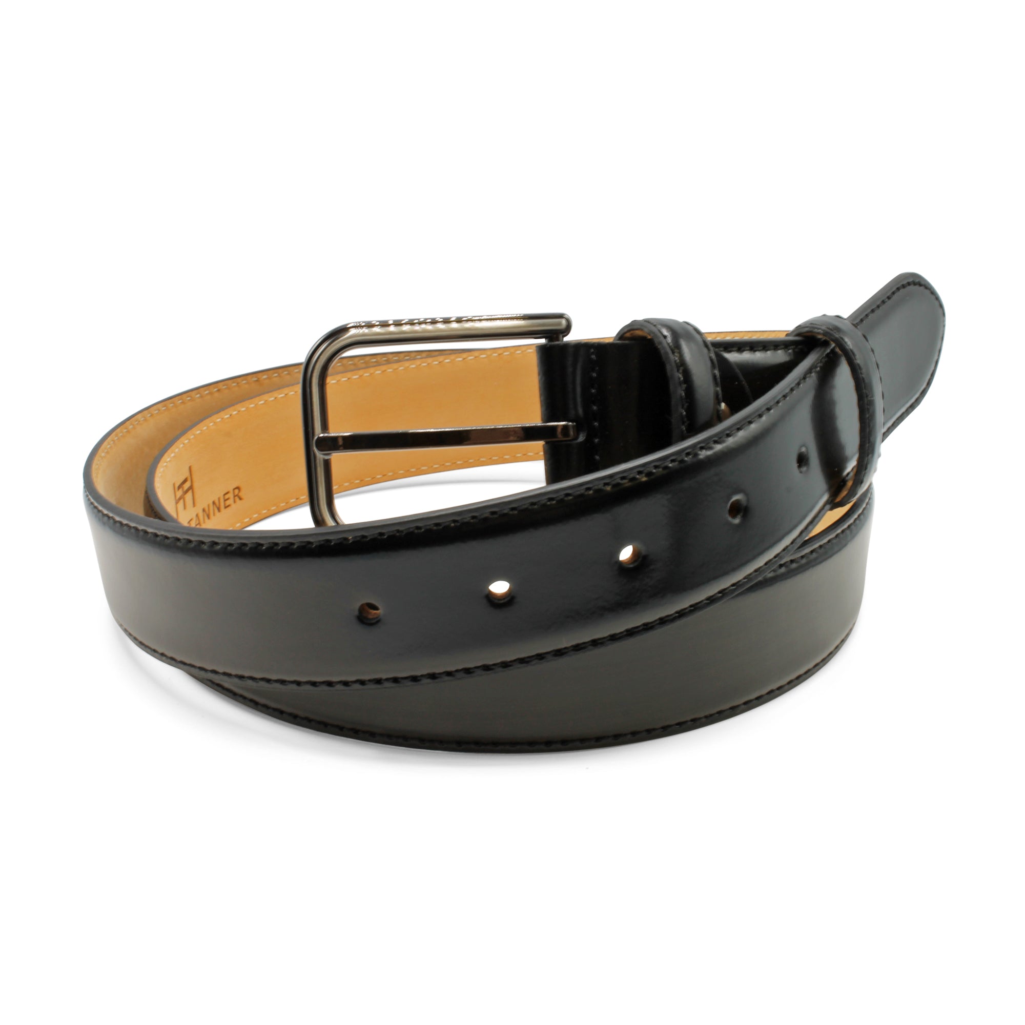 Black leather belt with a gold buckle on a white background. Huxley Tanner Belt Available at Sakks Menswear in Southampton.