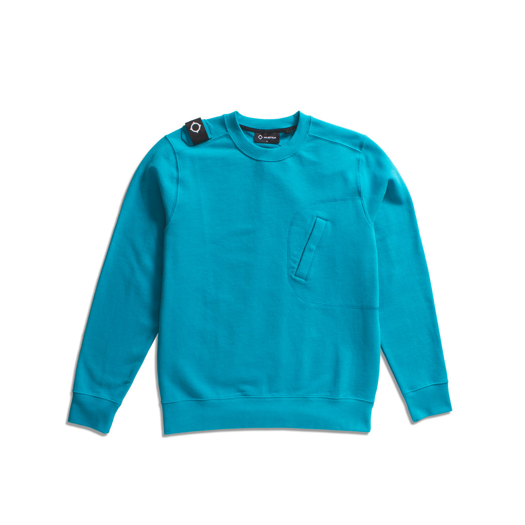 A bright turquoise crewneck sweatshirt with a chest pocket and a black button detail on the shoulder, laid flat on a white background. MA.Strum Sweatshirt available at Sakks Menswear in Southampton.