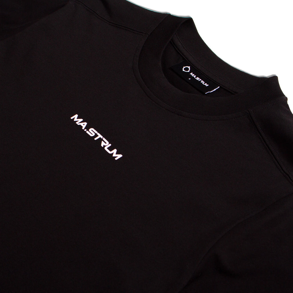 Close-up of a black crewneck sweatshirt with the brand name 'MA.STRUM' printed in white on the left chest and on the inner neck label. MA.Strum T-Shirt available at Sakks Menswear in Southampton.