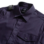 Close-up of a dark navy button-up shirt by Maistrún, showing the collar, chest pocket, and shoulder tab against a white background. MA.Strum Short Sleeve Shirt available at Sakks Menswear in Southampton.