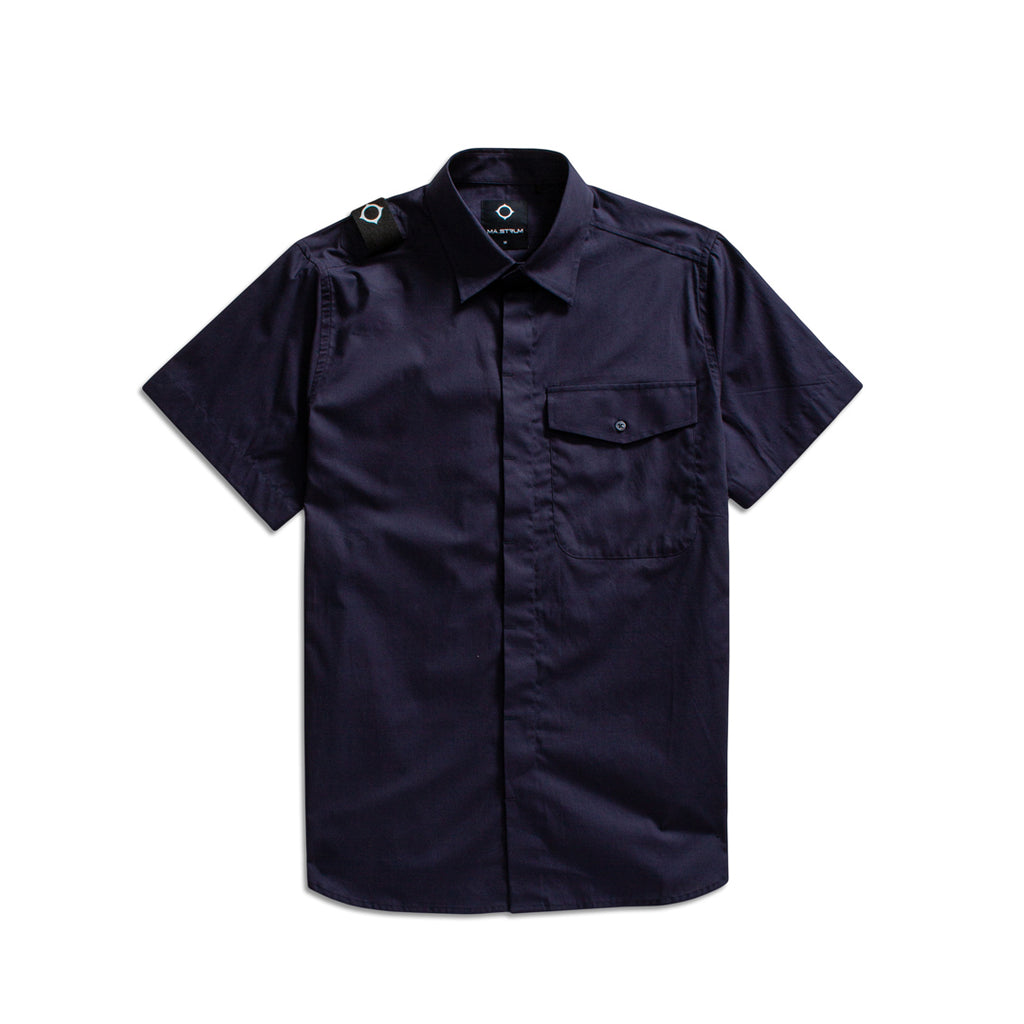 A dark navy blue short-sleeve button-up shirt with a chest pocket and shoulder epaulets, displayed flat against a white background. MA.Strum Short Sleeve Shirt available at Sakks Menswear in Southampton.