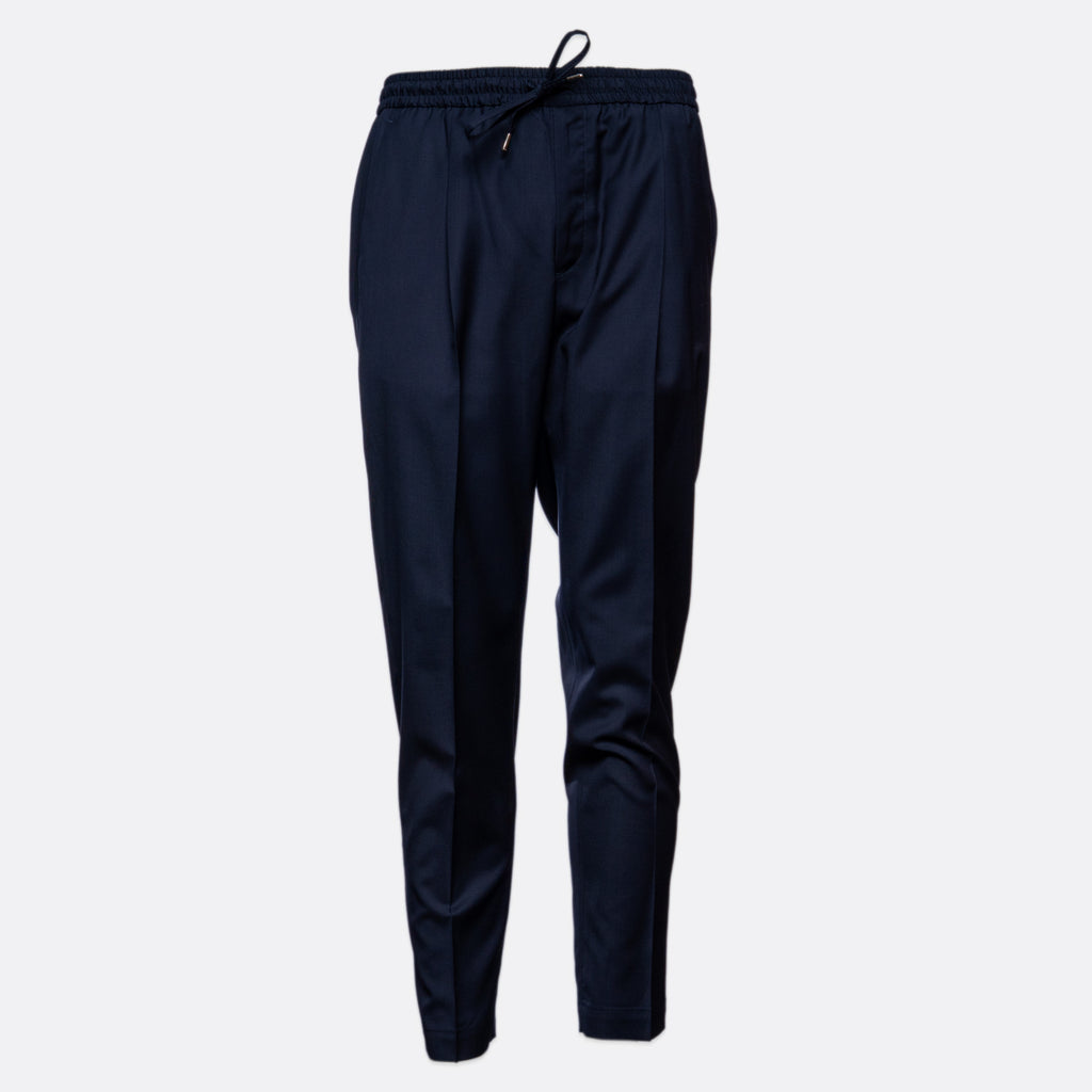 A pair of dark navy blue athletic pants with an elastic waistband and drawstring, shown against a plain light gray background. Briglia Trouser Sakks Menswear Southampton.