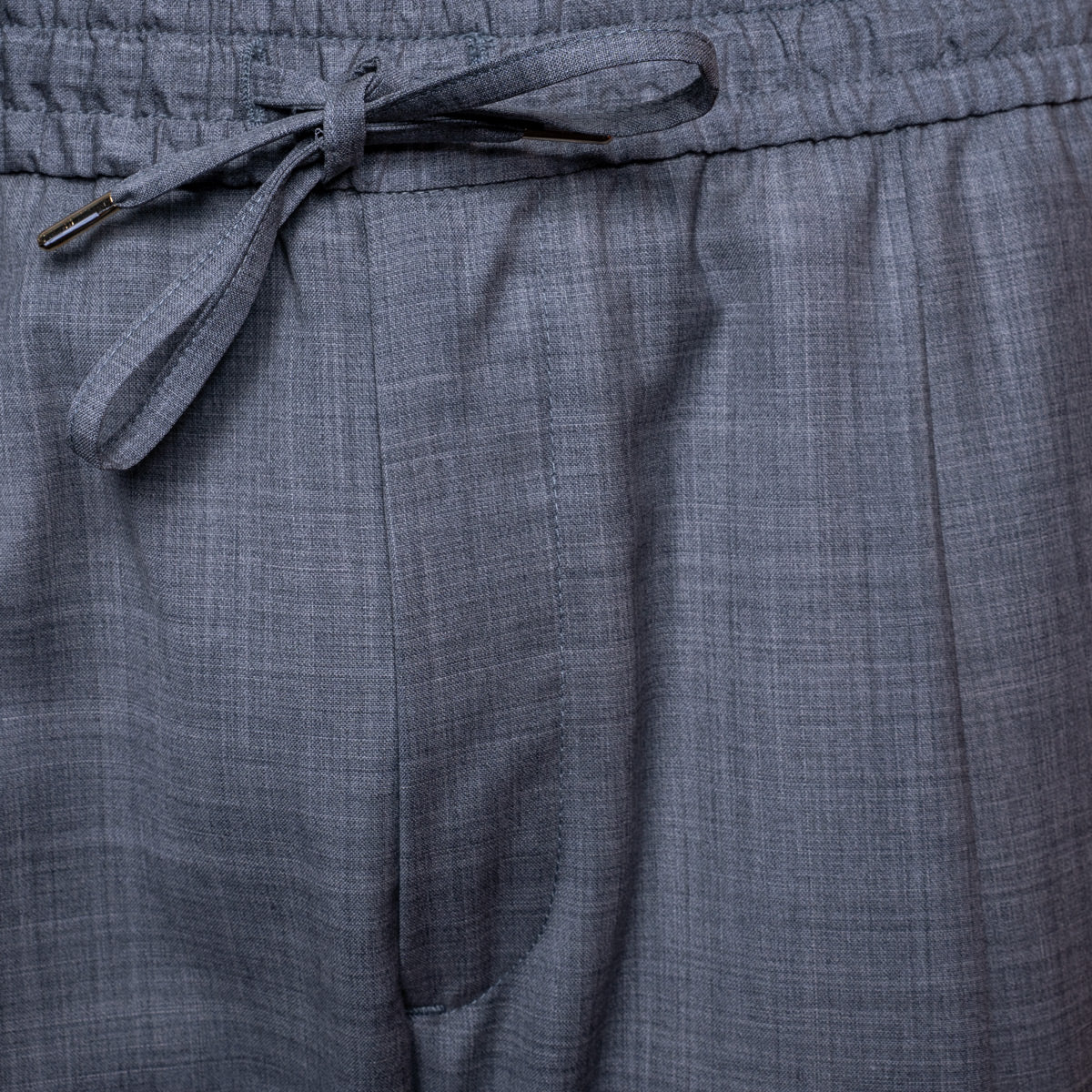 Close-up of gray textured drawstring shorts showing the fabric weave and waistband. Briglia Trousers. Sakks Menswear Southampton.