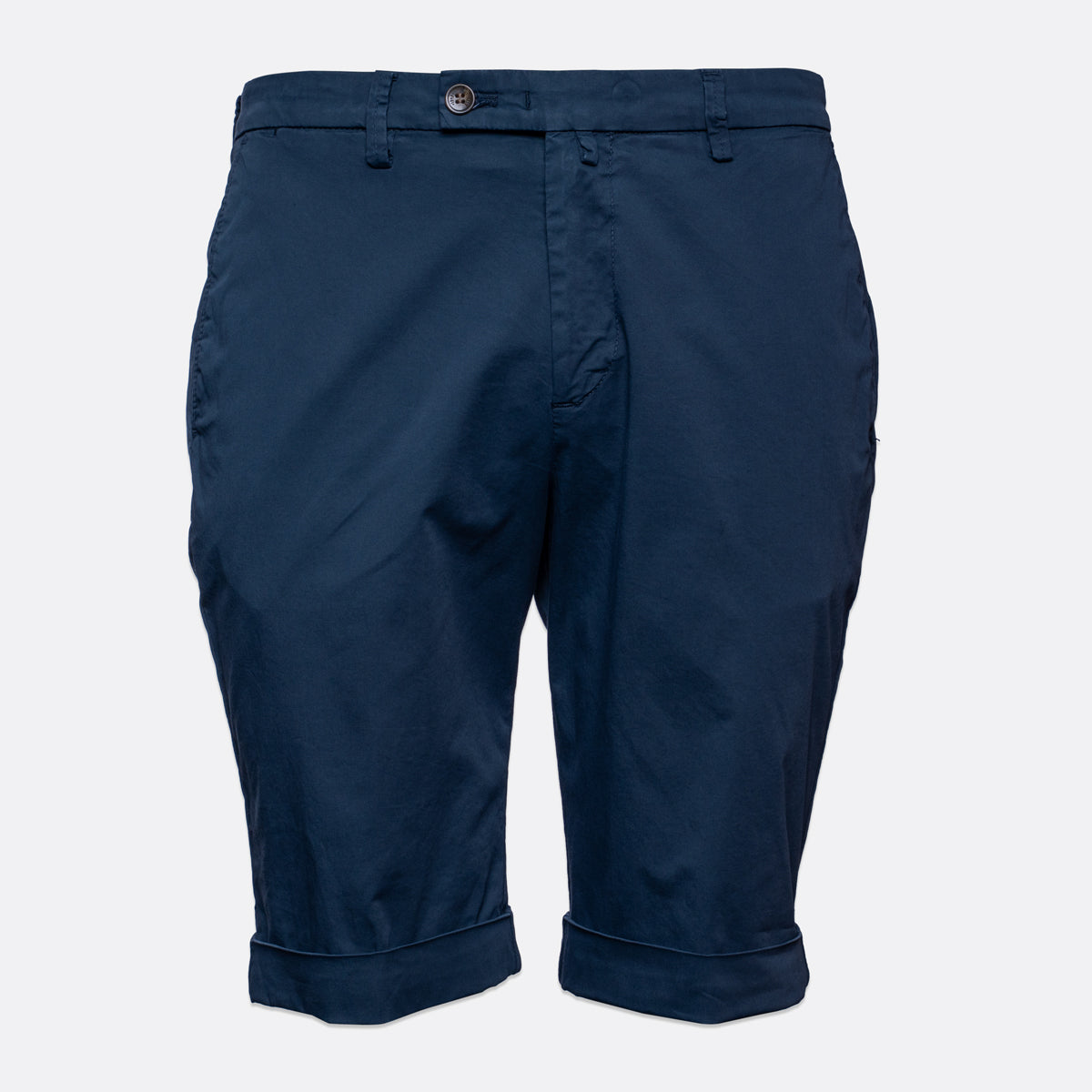 A pair of navy blue chino shorts with a button closure and rolled cuffs, shown against a light grey background. Briglia Bermuda Shorts. Sakks Menswear Southampton.