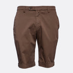A pair of brown chino shorts with rolled cuffs, shown against a plain light gray background. Briglia Bermuda Shorts. Sakks Menswear Southampton.