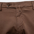 Close-up of brown trousers showing the waistband, button closure, belt loops, and front seam. Briglia Bermuda Shorts. Sakks Menswear Southampton.