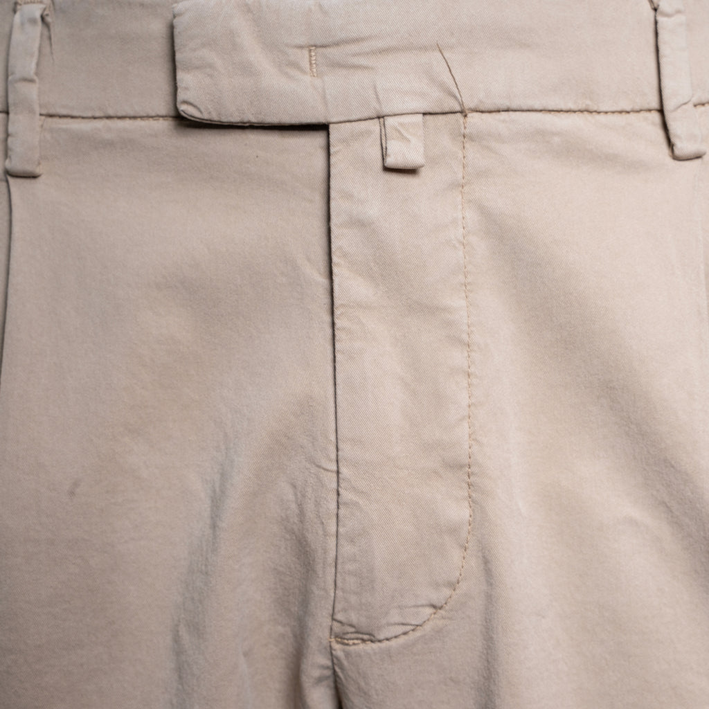 Close-up of light beige trousers showing the waistband, belt loops, front fly, and a side welt pocket. Briglia Trousers. Sakks Menswear Southampton.