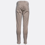 A pair of slim-fit trousers shown from the back, in a solid taupe-beige colour, displayed on a clean white background. Briglia Trousers. Sakks Menswear Southampton.