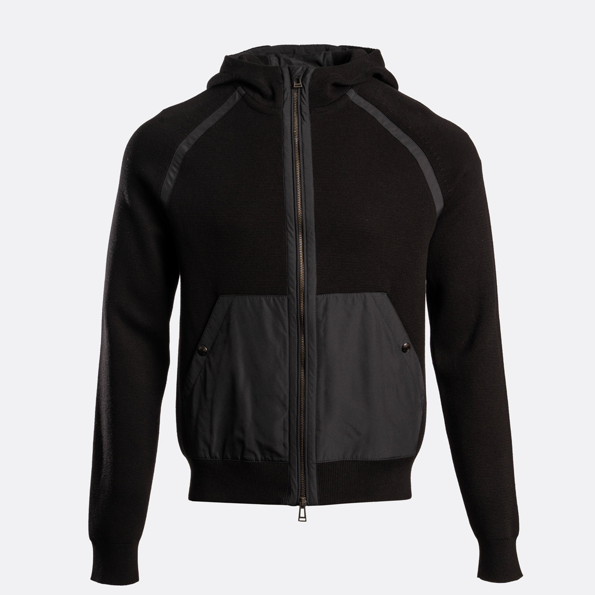 A black zip-up hooded jacket with contrasting dark gray front pockets and shoulder panels, shown on a light gray background. Belstaff Hoodie. Sakks Menswear Southampton.