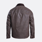 A dark brown waxed cotton jacket shown from the back, featuring a collar and long sleeves, photographed against a light gray background. Belstaff Jacket. Sakks Menswear Southampton.