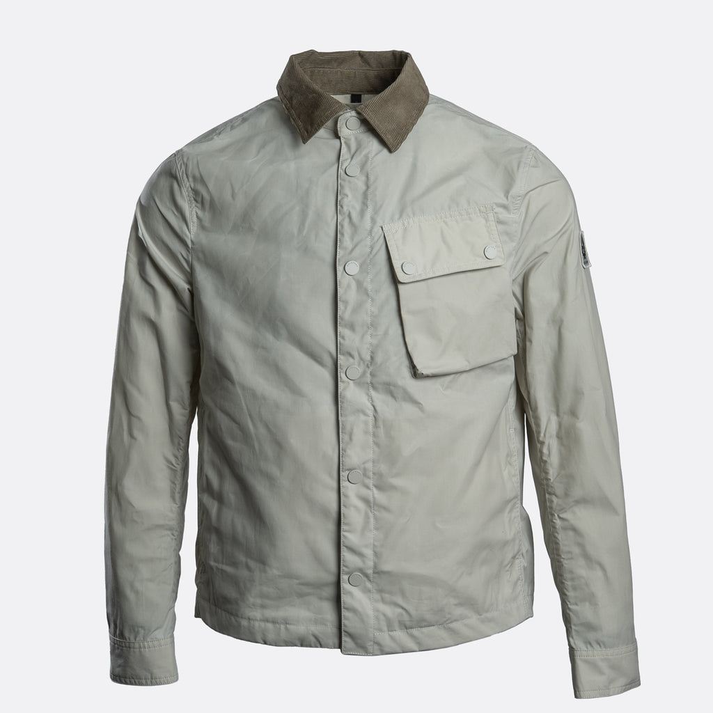 A light gray utility shirt jacket with a contrasting brown corduroy collar, featuring a button-up front, a chest pocket with a snap flap, and button cuffs. Belstaff Jacket. Sakks Menswear Southampton.