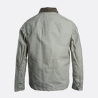 The back view of a light gray utility jacket with a contrasting dark brown collar, displayed on a clean light gray background. Belstaff Jacket. Sakks Menswear Southampton.