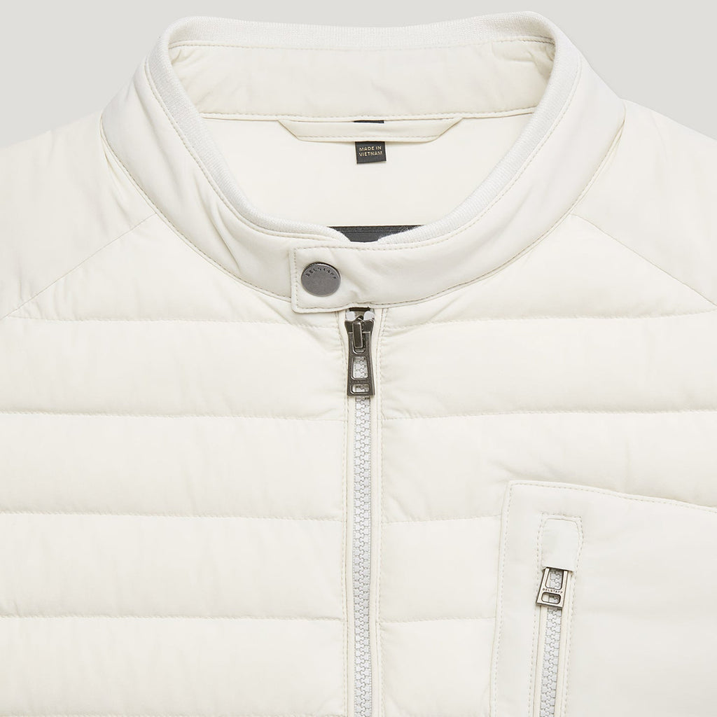 Close-up of a white puffer jacket with a stand-up collar, silver zipper, and a small visible GANT neck label. Belstaff Gilet. Sakks Menswear Southampton.