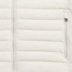 Close-up of a quilted puffer jacket in off-white, showing horizontal stitching, a front zipper, and a side zip pocket with a silver zipper pull. Belstaff Gilet. Sakks Menswear Southampton.