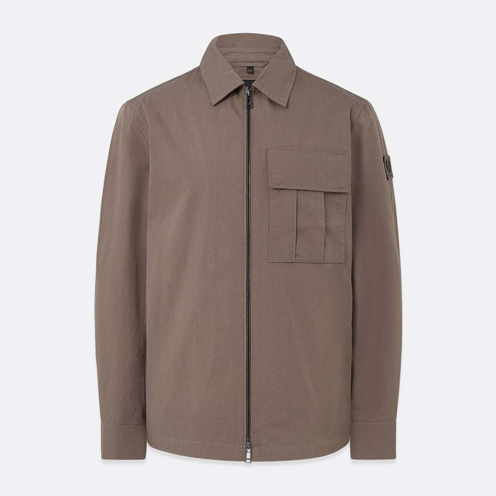 A brown utility jacket with a front zipper, collar, and a chest pocket, shown on a light gray background. Belstaff Jacket. Sakks Menswear Southampton.