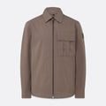 A brown utility jacket with a front zipper, collar, and a chest pocket, shown on a light gray background. Belstaff Jacket. Sakks Menswear Southampton.