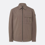 A brown utility jacket with a front zipper, collar, and a chest pocket, shown on a light gray background. Belstaff Jacket. Sakks Menswear Southampton.