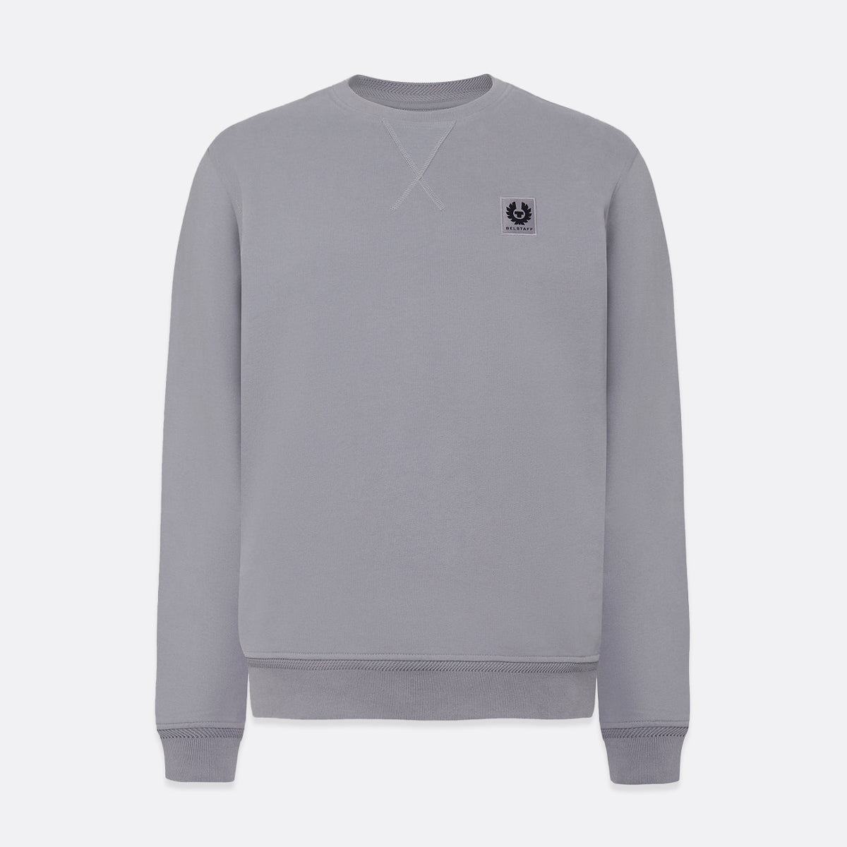 A light gray crewneck sweatshirt with a small black embroidered logo on the left chest, displayed on a clean light gray background. Belstaff Sweatshirt. Sakks Menswear Southampton.