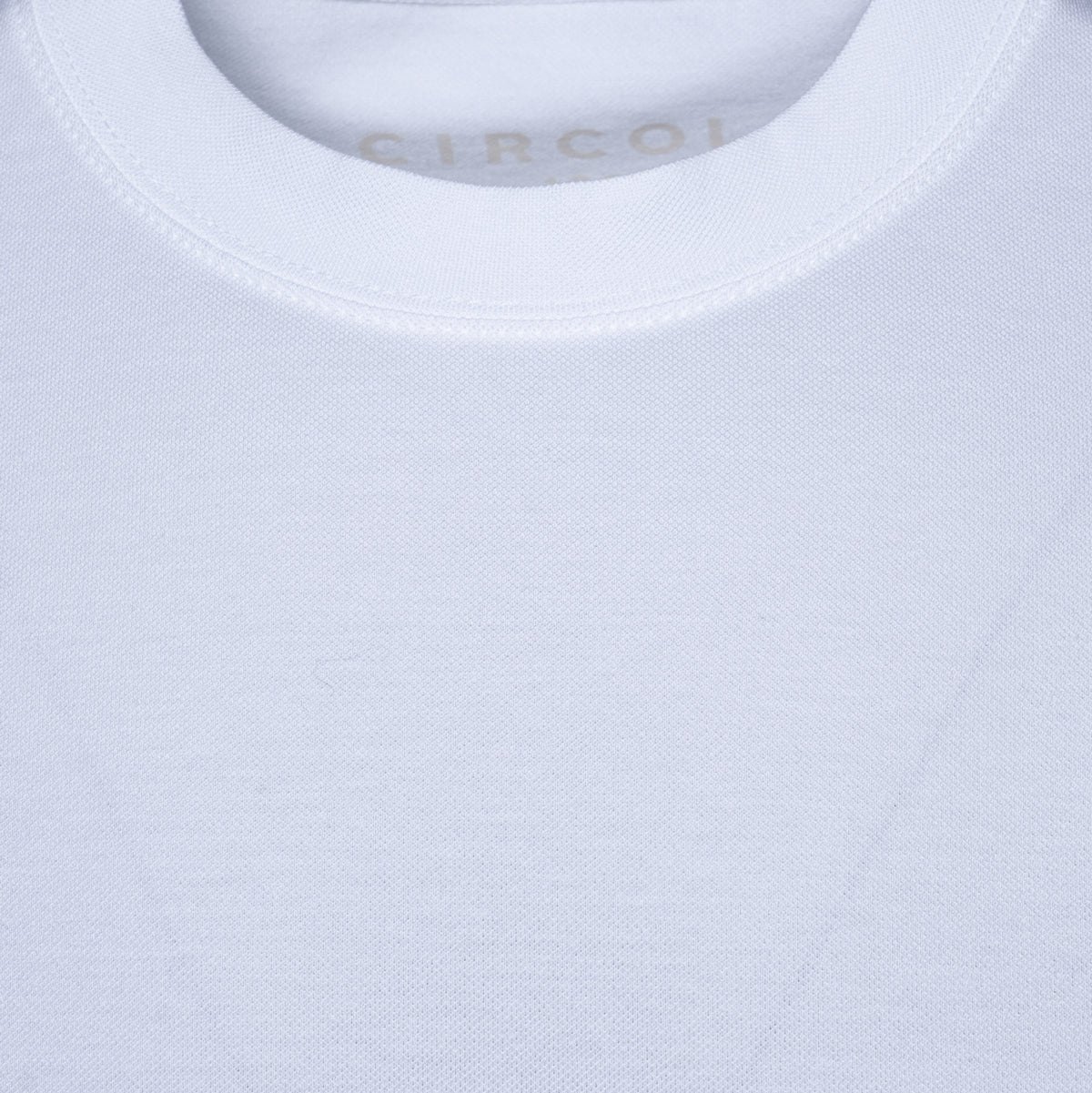 Close-up of a white crew-neck t-shirt showing the inner neck label with the brand name CIRCOLO. Circolo 1901 T-Shirt. Sakks Menswear Southampton.