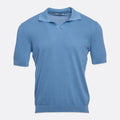 A light blue short-sleeve knit polo shirt with a textured waffle pattern, displayed on a clean, light grey background. Circolo 1901 Polo Shirt. Sakks Menswear Southampton.