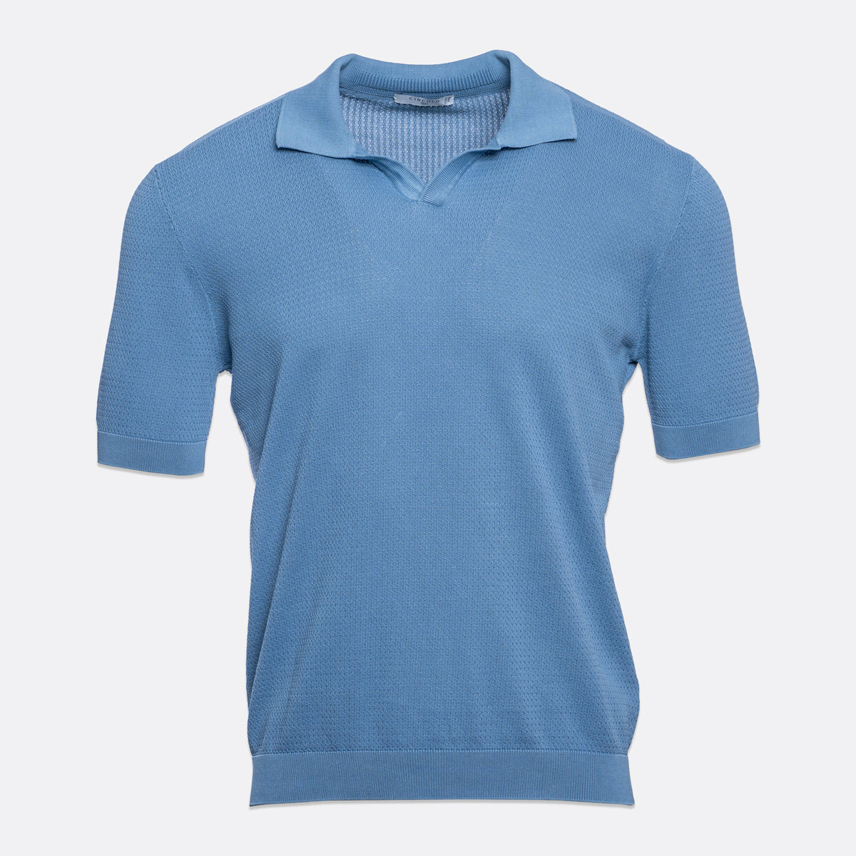 A light blue short-sleeve knit polo shirt with a textured waffle pattern, displayed on a clean, light grey background. Circolo 1901 Polo Shirt. Sakks Menswear Southampton.