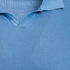 Close-up of a light blue knit polo shirt showing the textured fabric and collar detail. Circolo 1901 Polo Shirt. Sakks Menswear Southampton.