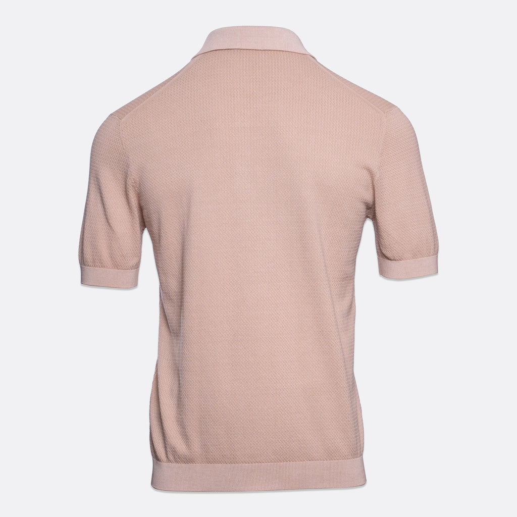 A light pink short-sleeve knit polo shirt shown from the back, displayed on a clean, light grey background. Circolo 1901 Polo. Sakks Menswear Southampton.