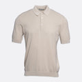 A short-sleeve polo shirt in a light beige or cream colour, featuring a textured knit fabric, a classic collar, and a two-button placket, shown against a plain light grey background. Circolo 1901 Polo. Sakks Menswear Southampton.
