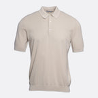 A short-sleeve polo shirt in a light beige or cream colour, featuring a textured knit fabric, a classic collar, and a two-button placket, shown against a plain light grey background. Circolo 1901 Polo. Sakks Menswear Southampton.
