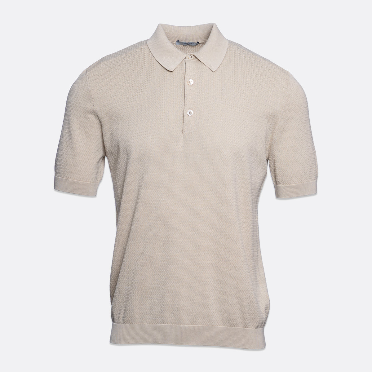 A short-sleeve polo shirt in a light beige or cream colour, featuring a textured knit fabric, a classic collar, and a two-button placket, shown against a plain light grey background. Circolo 1901 Polo. Sakks Menswear Southampton.