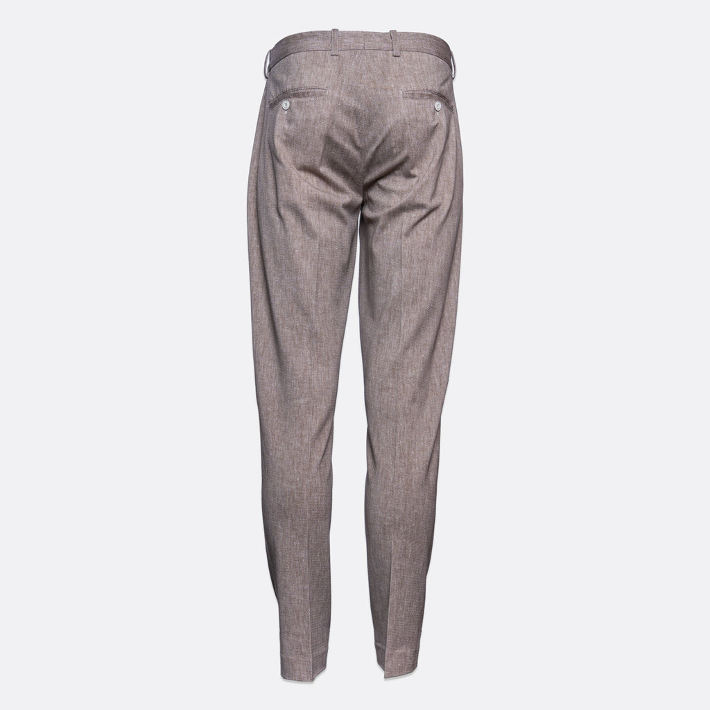 A pair of slim-fit trousers shown from the back, featuring a subtle textured pattern in a muted grayish-brown tone, set against a plain light gray background. Circolo 1901 Trousers. Sakks Menswear Southampton.