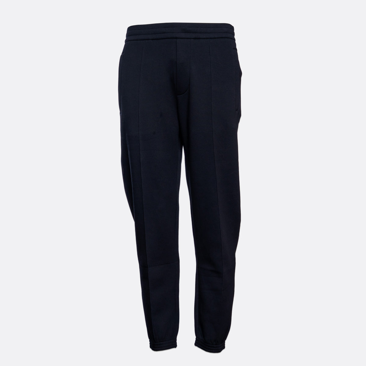 A pair of dark navy blue sweatpants shown from the back against a light gray background. Emporio Armani Sweat Pants. Sakks Menswear Southampton.