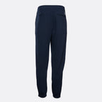 A pair of dark navy blue sweatpants shown from the back, featuring a relaxed fit and a small embroidered logo on the upper right side, set against a plain light gray background. Emporio Armani Sweat Pants. Sakks Menswear Southampton.