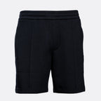 Black athletic shorts with a wide elastic waistband and side pockets, shown against a light gray background. Emporio Armani Shorts. Sakk Menswear Southampton.