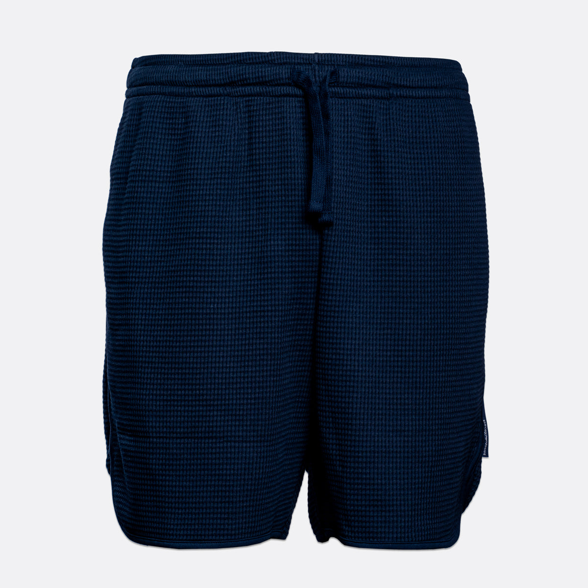 A pair of dark navy blue waffle-knit shorts with an elastic drawstring waistband, shown against a plain light gray background. Emporio Armani Shorts. Sakks Menswear Southampton.