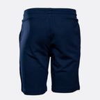 A pair of navy blue sweat shorts shown from the back, featuring an elastic waistband and side pockets, set against a plain light gray background. Emporio Armani Shorts. Sakks Menswear Southampton.