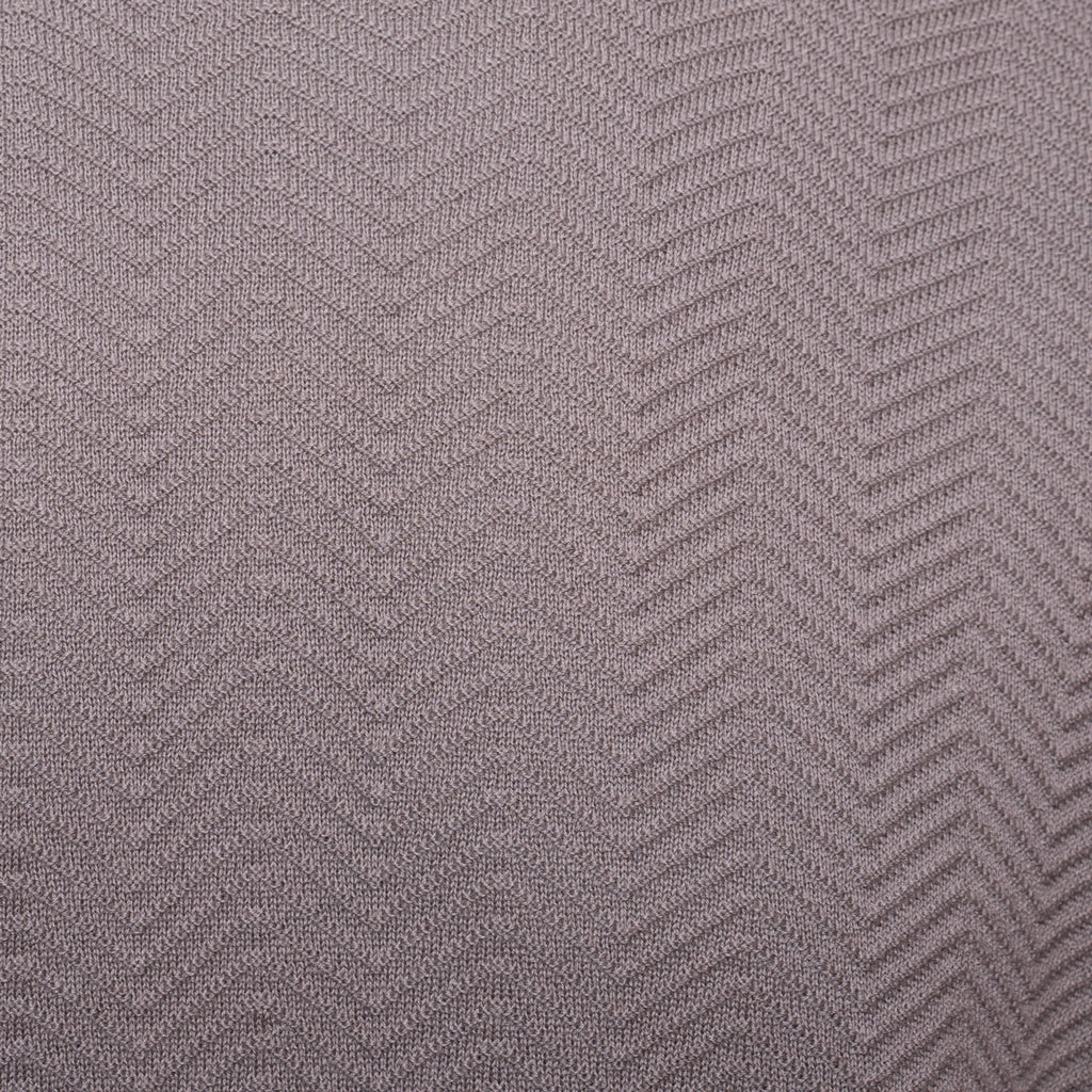 A close-up of a textured fabric with a woven herringbone pattern in a muted taupe-gray color. Emporio Armani T-Shirt. Sakks Menswear Southampton.