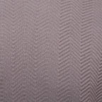 A close-up of a textured fabric with a woven herringbone pattern in a muted taupe-gray color. Emporio Armani T-Shirt. Sakks Menswear Southampton.