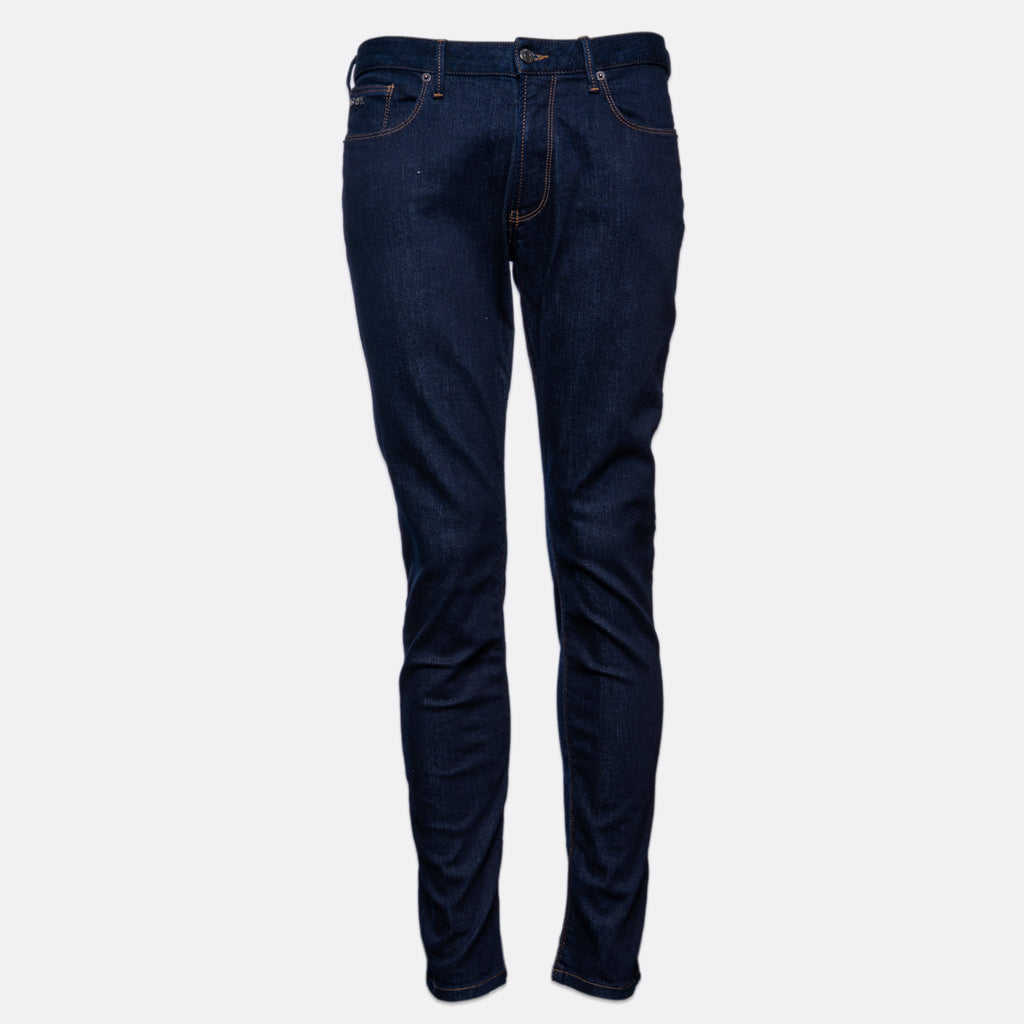 Dark blue slim-fit denim jeans shown on a light gray background. Emporio Armani Jeans. Sakks Menswear Southampton.