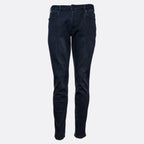 Dark navy blue slim-fit jeans shown from the front on a light gray background. Emporio Armani Jeans. Sakks Menswear Southampton.