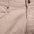 Close-up of a pair of light beige canvas pants showing the waistband, button, belt loop, and pocket stitching. Emporio Armani Chinos. Sakks Menswear Southampton.