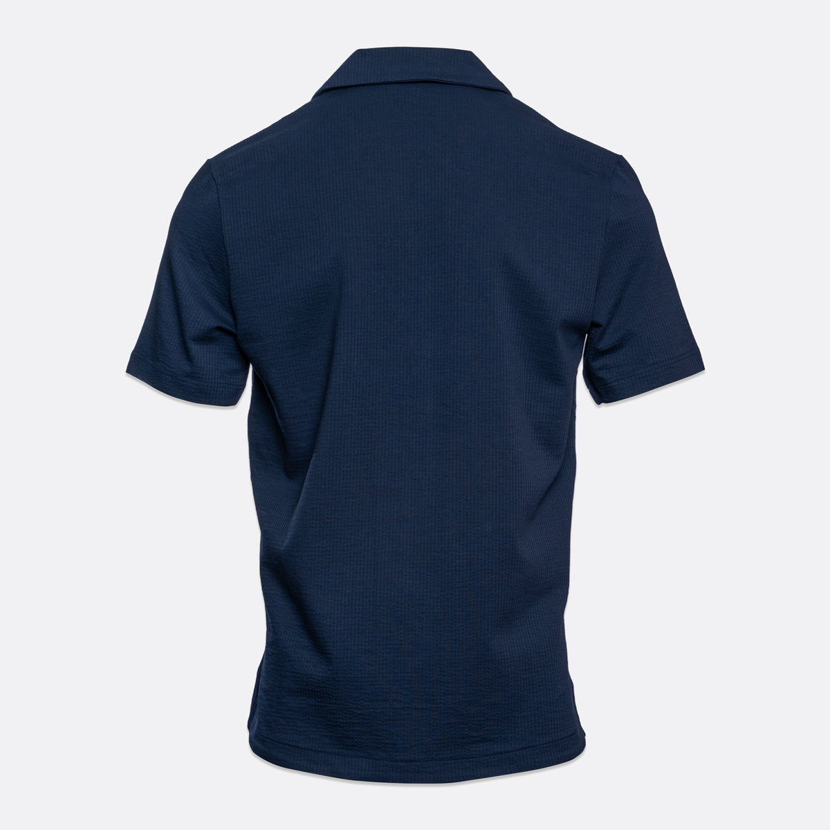 A dark navy blue short-sleeve polo shirt shown from the back, displayed on a clean, light gray background. Emporio Armani Short Sleeve Shirt. Sakks Menswear Southampton.