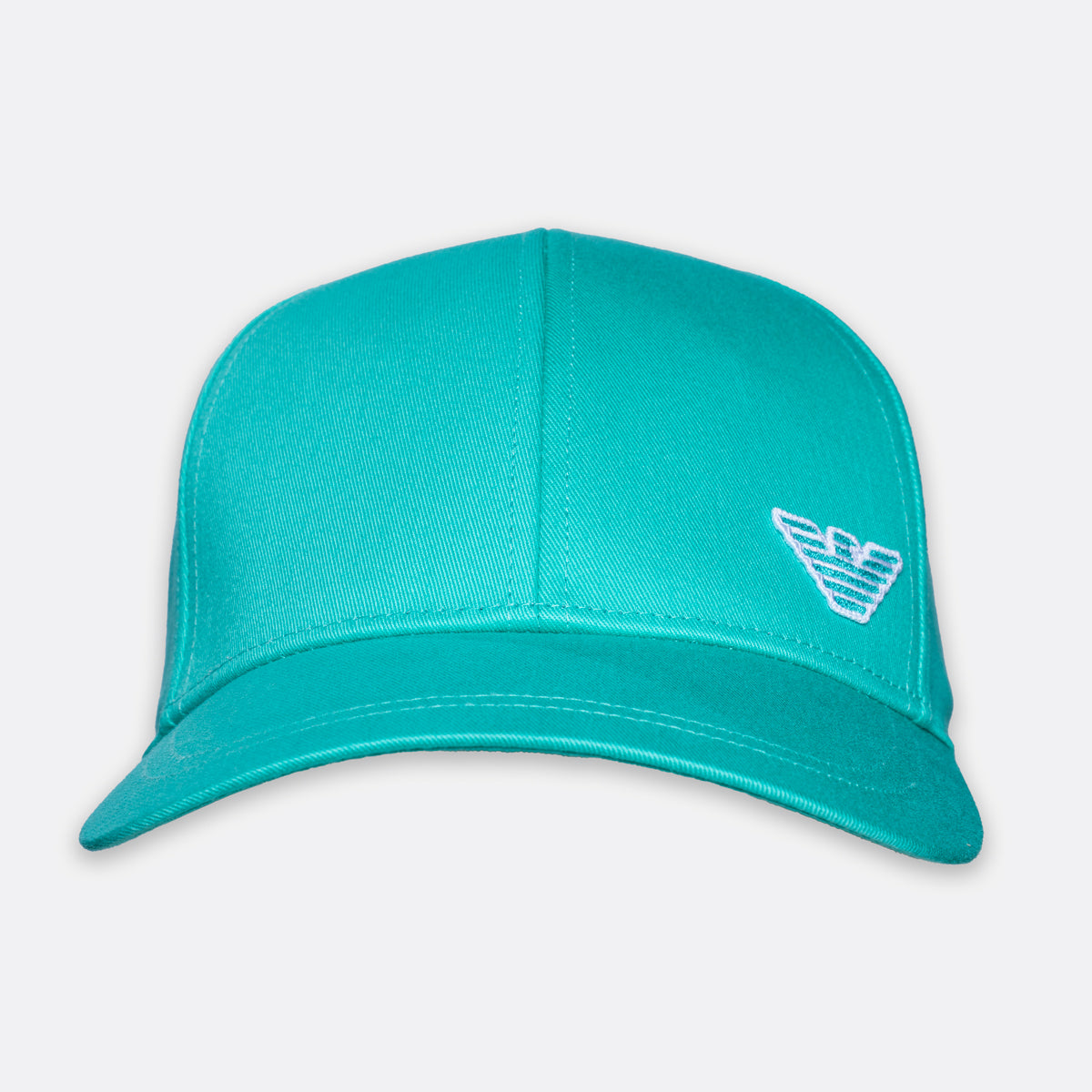 A turquoise baseball cap with a white embroidered logo on the side, displayed against a light gray background. Emporio Armani Cap. Sakks Menswear Southampton.