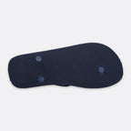 A dark navy blue flip-flop sole with fine vertical pinstripes and two circular blue accents, shown from a top-down view on a light gray background. Emporio Armani Flip Flops. Sakks Menswear Southampton.