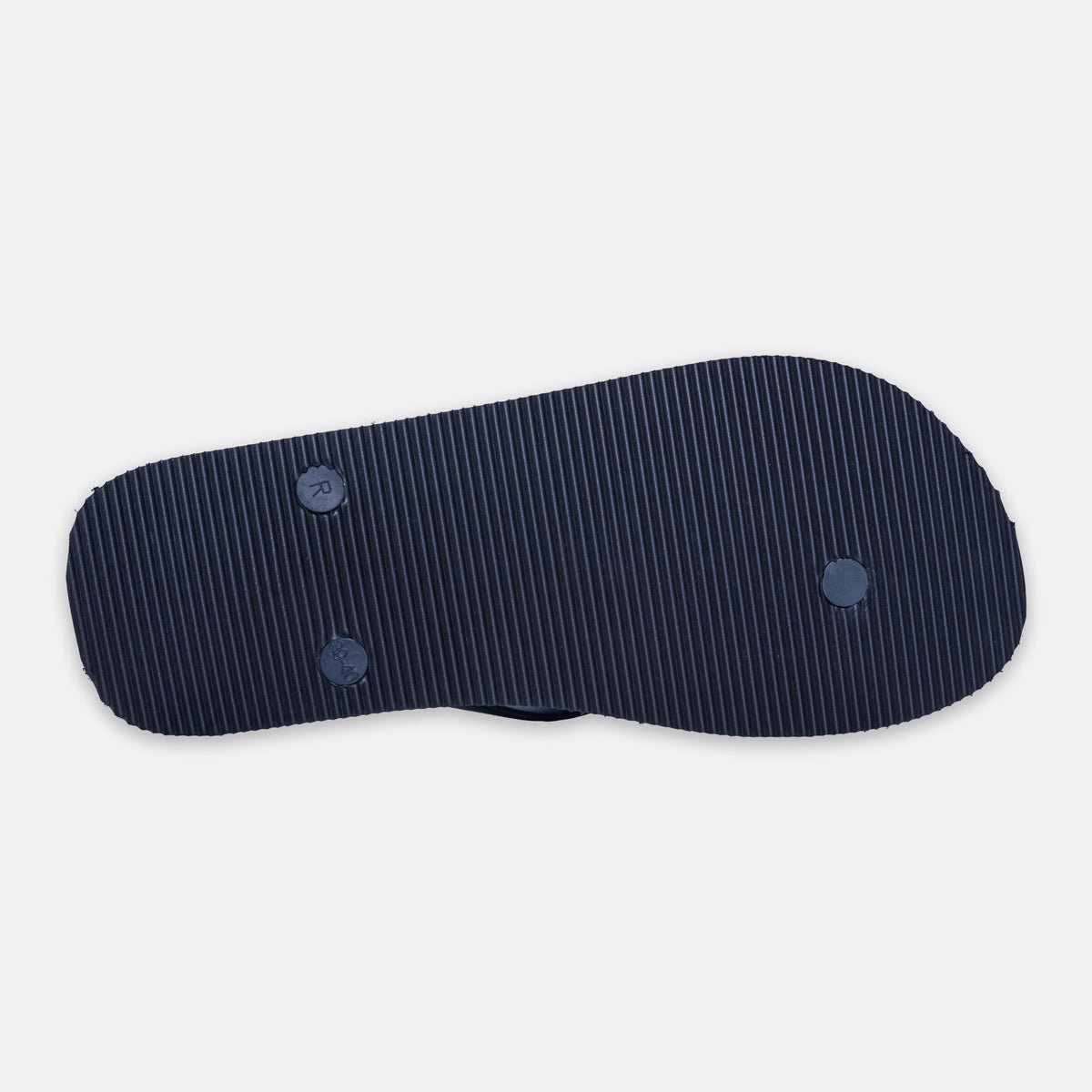 A dark navy blue flip-flop sole with fine vertical pinstripes and two circular blue accents, shown from a top-down view on a light gray background. Emporio Armani Flip Flops. Sakks Menswear Southampton.