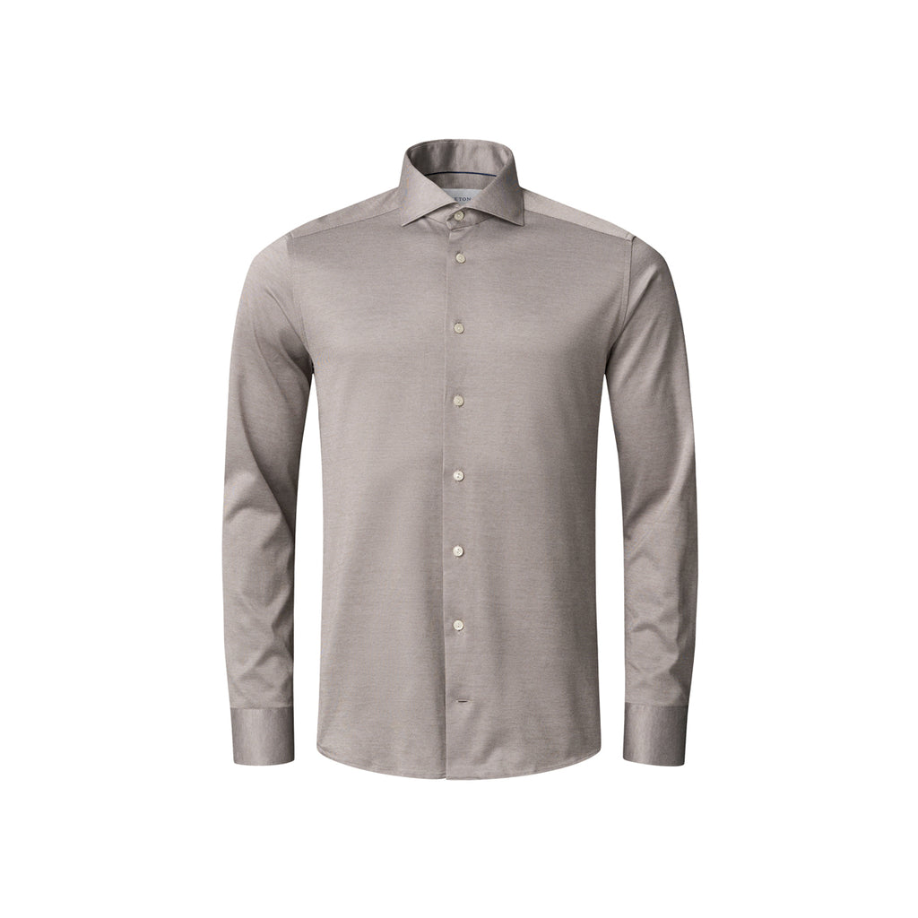 A light taupe-grey long-sleeve button-down dress shirt with a spread collar, shown on a plain white background. Eton Shirt available at Sakks Menswear in Southampton.