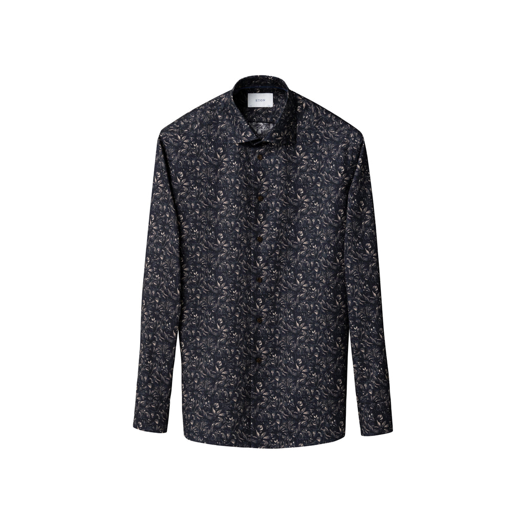 A long-sleeve button-up shirt with a dark charcoal and black base, covered in a dense, small-scale white and light grey abstract floral or leaf print, shown against a plain white background. Eton Shirt available at Sakks Menswear in Southampton.